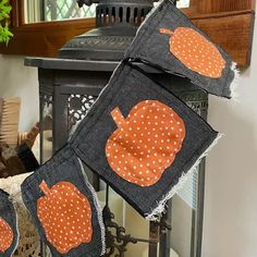 three pieces of fabric with pumpkins on them