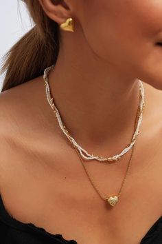 Handwoven with love, this 18K gold pearl necklace boasts luminous pearls delicately entwined within a golden chain. Rock it with your favorite blouse or dress up your LBD – either way, you'll be turning heads wherever you go! Pearl Beaded Necklace With Chain, Elegant White Beaded Necklace With Chain, Chic Pearl Necklace With Beaded Chain, White Multi-strand Chain Necklace For Party, Gold Beaded Necklaces For Party With Clavicle Chain, White Multi-strand Clavicle Chain Necklace, Gold Beaded Clavicle Chain Necklace For Party, Gold Chain Necklace With Pearl Pendant For Party, Party Gold Chain Necklace With Pearl Pendant