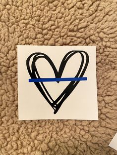 a piece of paper with a heart drawn on it