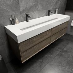 black and white photograph of a bathroom sink with two faucets on the side