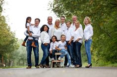 a family poses for a photo in the park