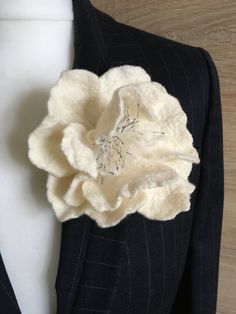 a suit jacket with a flower on the lapel