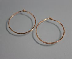 "These hoops are made of hand hammered 18 ga 14k Gold Filled. Approx. 1\" diameter. They are bent and hammered and then polished to a glittery shine by me. A basic essential to have. All items are presented in a 100% recycled paper box with a paper raffia bow. Thank you for looking at my shop. http://www.etsy.com/shop/tinysparklestudio?ref=si_shop For vintage clothing and uniquities, check out my hubby's shop Joestitchn http://www.etsy.com/shop/JoeStitchn?ref=si_shop" Paper Box, Recycled Paper, Vintage Clothing, Gold Filled, Etsy Earrings, Vintage Outfits, Hoop Earrings, Texture, Gold