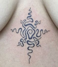 a tattoo on the back of a woman's neck with an abstract design in black ink