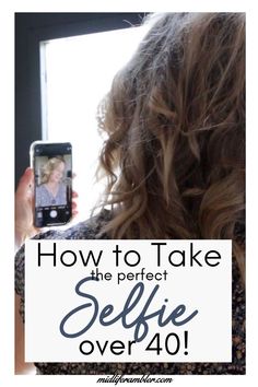 a woman taking a selfie with her cell phone text reads how to take the perfect selfie over 40