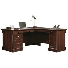 an office desk with two drawers and a laptop on it