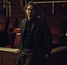 a man standing in front of an empty theater