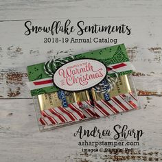 an ad for the annual catalog with candy canes in it on a white wooden background