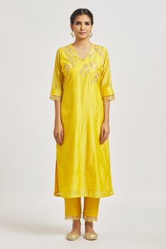 Yellow straight kurta with placement paisley embroidery. Comes with embroidered semi-sheer hem pant
Components: 2
Pattern: Embroidered
Type Of Work: Paisley
Neckline: V Neck
Sleeve Type: Three Quarter
Fabric: Organza, Muslin, Chanderi
Color: Yellow
Other Details: 
Attached lining
Back elasticated pant waistband
Length:
Kurta: 48
Pant: 37.5
Approx. product weight: 1 kg
Occasion: Puja - Aza Fashions Diwali Churidar With Embroidered Border, Straight Tissue Silk Kurta With Embroidered Border, Tissue Silk Straight Kurta With Embroidered Border, Fitted Raw Silk Kurta With Embroidered Border, Embroidered Cotton Silk Churidar, Intricate Embroidery Churidar With Traditional Drape, Embroidered Straight Kurta In Tissue Silk, Anarkali Tissue Silk Kurta With Embroidered Border, Embroidered Tissue Silk Straight Kurta