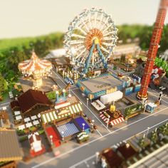 an aerial view of a carnival with ferris wheel and rides