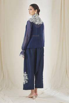 Indigo shirt with tassel detail and floral embroidery. Paired with crop top and embroidered, drop crotch pant.
Component: 3
Pattern: Embroidered
Type Of Work: Floral,Paisley
Neckline: High Neck
Sleeve Type: Sheer
Color: Blue
Other Details: 
Front buttons
Tassel overlay
Occasion: Party - Aza Fashions Tassel Shirt, Anamika Khanna, Drop Crotch Pants, Blue Tassel, Fashion App, Pant Set, Shirt And Pants, Set For Women, Aza Fashion