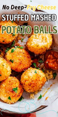 a plate full of baked potato balls with ketchup on the side and text that reads, no deep fry cheese stuffed mashed potato potato balls