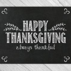 a chalkboard sign that says happy thanksgiving