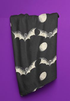 bats flying over the moon on black and white paper with purple background for halloween decoration