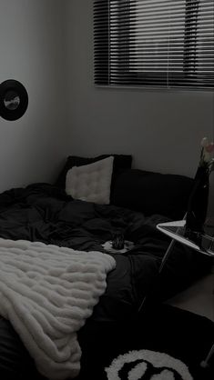 a black and white photo of a bedroom