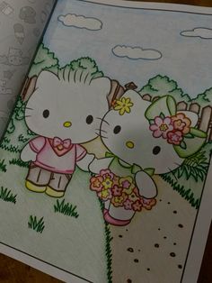 an open coloring book with two hello kitty characters holding flowers in front of the pages