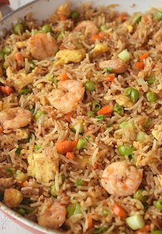 rice with shrimp, peas and carrots in a bowl