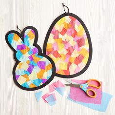 paper cut out to look like an easter egg and bunny ears with scissors next to it