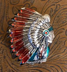 "Vintage Bob Mackie Indian Chief Trinket Box 2\" x 1.5\" .5\" height  Silver tone. Hinged box. Enameling and rhinestones. Missing two stones. This is such an unusual find for my shop!! It is in EXCELLENT condition but is missing 2 stones!! It snaps shut tightly! Lovely Indian Chief trinket box. Such a beautiful piece for anyone who collects trinket boxes or Bob Mackie!!  Enjoy  This listing would be $90.00. Discount: 2 stones missing. $70.00 Please note: Vintage in my shop means-Sold \"As Is\". Unique Rhinestone Jewelry Gift, Unique Rhinestone Jewelry For Gifts, Unique Rhinestone Brooch For Gift, Vintage Bob Mackie, Vintage Bob, Indian Chief, Bob Mackie, Jewellery Boxes, Trinket Boxes