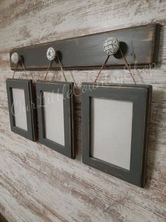 three framed pictures hang on a wall with twine pins attached to the two frames