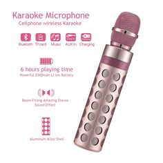 the karaoke microphone is pink and has silver dots on it, as well as buttons