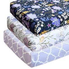 three sheets stacked on top of each other in different colors and patterns, with one folded down