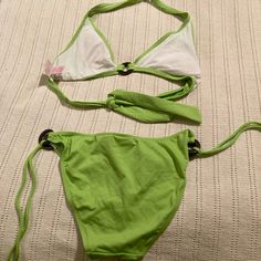 Lime Green Two Piece Bikini Never Worn Size Large Green Halter Neck Swimwear For Sunbathing, Green Halter Neck Swimwear For Poolside, Green Halter Neck Swimwear For Summer, Green Halter Neck Swimwear, Green Tie-side Bottom Swimwear For Beach, Green Stretch Swimwear For Vacation, Green Stretchable Swimwear For Vacation, Spring Poolside Tankini With Tie-side Bottom, Green Sleeveless Beachy Swimwear