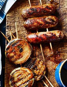 grilled sausages and onions on skewers with dipping sauce