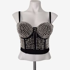 Black Corset Bustier, Accented With Silver Spikes. The Straps Are Detachable So It Can Be Worn Strapless. It Has Underwire For Support And The Cups Are Thickly Lined. Multi Row, Back Hook And Eye Closure. Silicone Gripping On The Inside To Help It Stay Put. Fabric - Polyester, Elastane Blend Sizes Available: Xs (2) Bust Size 30.5" S (4) Bust Size 32.5" M (6) Bust Size 34.5" L (8/10) Bust Size 37" Choose Sizing According To 'Bust Size'. Ships In 5 - 10 Days. Check Out My Shop For Styles/Events: R Silver Fitted Crop Top With Rhinestones, Silver Rhinestone Fitted Crop Top, Glamorous Black Summer Corset, Elegant Silver Crop Top For Evening, Silver Fitted Crop Top For Night Out, Edgy Strapless Corset For Party, Edgy Strapless Party Corset, Edgy Corset For Summer Parties, Edgy Party Corset For Summer