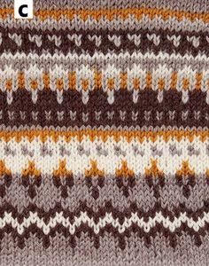 a knitted blanket with brown, white and orange stripes