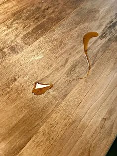 a piece of wood that has been cut in half and is sitting on the floor