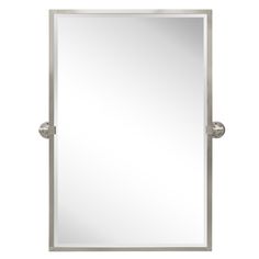 a bathroom mirror that is on top of a white wall and has two metal handles