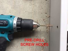 a drill is being used to screw holes in a wall with the words pre - drill screw holes