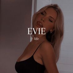 a woman in a black dress with the words evie lite above her head