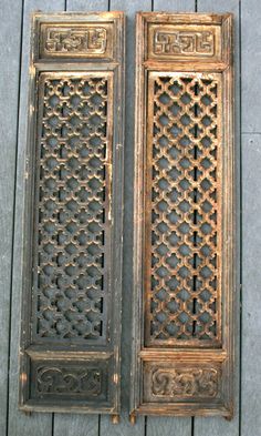 an old wooden door with intricate carvings on it's sides and the top part missing