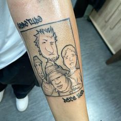 a person with a tattoo on their leg has an image of two men and one woman