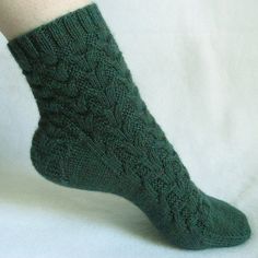 a woman's legs wearing green knitted socks