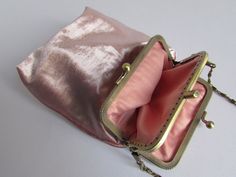 "Metallic pink wedding purse, kiss clasp princess crossbody mini bag, Cell Phone purse, bridal clutch, pink small bag, unique gifts for her, prom purse  Crossbody purse features: This purse is hand sewed by me. The fabric is really unique and particular: patterned color metallic pink. The metal frame is in bronze vintage-style. The inside is lined color pink. No glue is used. I sew the metal frame with the fabric. Fits iPhone (6-7-8)Plus, iPhone 11 pro max, iPhone XS max, iPhone 12, iPhone 12 pro, iPhone 12 pro max, iPhone 13, iPhone 13 pro, iPhone 13 pro max, iPhone 14, iPhone 14 pro, iPhone 14 pro max, iPhone 15, iPhone 15 pro, iPhone 15 pro max, Samsung Galaxy S6 edge-S6 edge Plus, Samsung Galaxy S7 edge, Samsung Galaxy Note 3-10, Samsung Galaxy Note 10 PRO, Samsung Galaxy S8 plus - S9 Prom Purse, Clutch Pink, Cell Phone Purse, Wedding Purse, Wedding Clutch, Bridal Clutch, Purse Crossbody, Pink Purse, Wedding Bag