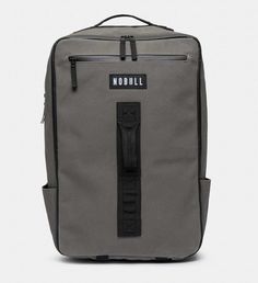 a grey backpack with black straps and the word moonhill on it's side