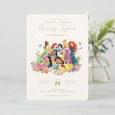 the disney princess thank you card is sitting on a table next to a vase with flowers