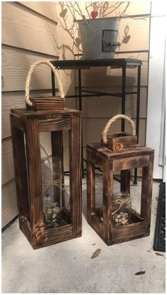 two wooden lanterns sitting next to each other