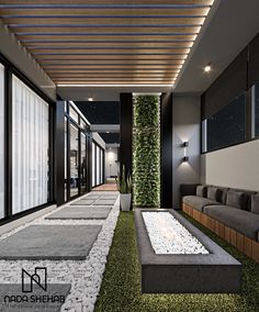 an outdoor living area with grass and plants