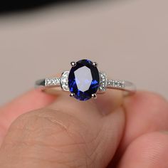 This is a gorgeous handmade creation. Its beauty is its simplicity & Elegance. The 6*8mm oval cut lab sapphire is crafted in solid sterling silver and with rhodium plated. It's made to order and it will take about 7 days to make it. All item is sent in a beautiful gift box You can realize more lovely stuff clicking the link https://www.etsy.com/shop/knightjewelry?refshopsection_shophome_leftnav Please leave the correct address and you phone number for delivering successfully. Oval Sapphire Promise Ring, Oval Lab-created Sapphire Ring, Silver Oval Sapphire Ring, Oval Cubic Zirconia Sapphire Ring Gift, Oval Sapphire Ring In Sterling Silver, Oval Lab-created Sapphire Birthstone Ring, Oval Solitaire Sapphire Ring With Cubic Zirconia, Oval Sapphire Ring As Gift, Oval Sapphire Ring Gift