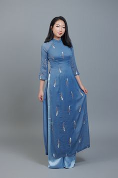 Custom Ao Dai featuring unique, embroidered, sheer fabric over blue, chiffon lining. After ordering we will send you a quick and simple form to guide you through taking the measurements we require for an amazing fit. Shipping details: Please allow 3-4 weeks for custom making and shipping, once measurements are received. Colors: Please note; we make every effort to ensure our photos accurately represent the true colors of each garment, but due to the nature of different devices, screen brightness, lighting conditions etc. small variations can sometimes occur. Festive Fitted Blue Ao Dai, Blue Summer Dresses With Sheer Dupatta, Simplest Form, Sheer Fabric, Sheer Fabrics, Dress Clothes For Women, True Colors, Vietnam, Custom Made