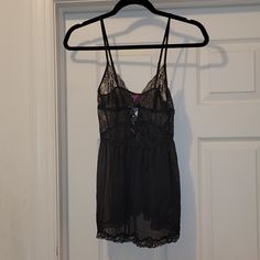 Adore Me Size Small Black Babydoll With Matching Panty.Nwt. Babydoll Nylon/Spandex Triangle Unlined Lace Cups Crisscross Satin Ribbon & Bow Detail Fully Adjustable Straps Empire Waist Mesh Body With Bottom Lace Trim Matching Bikini Panty Black Black Sheer Camisole Sleepwear, Black Stretch Sleepwear With Lace Trim, Black Sheer Camisole For Night, Black Stretch Camisole Sleepwear, Black Sheer Camisole For Loungewear, Bustier Lingerie, Black Babydoll, Pink Lace Bralette, Satin Ribbon Bow