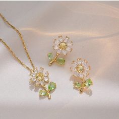 Description:Daisy Flower Necklace Earrings Set Specifications: Size: Necklace 40 cm + 5 cm ext/Earrings 2.5 cm *1.5 cmMaterial: copper, cubic zirconia, gold, silverColors: Gold/SilverHypoallergenic: Yes Get ready to bloom with this fresh and playful Daisy Flower Necklace Earrings Set! Adorned with delicate daisies, this set adds a touch of whimsy to any outfit. Perfect for those who embrace their fun-loving side! (And what's better than a matching set?🌼) Daisy Jewellery, Daisy Pendant, Daisy Jewelry, Daisy Design, Daisy Necklace, Flower Pendant Necklace, Jewellery Set, Stunning Necklace, Flower Jewellery