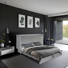 a bedroom with black walls and white furniture