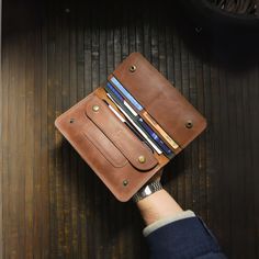 🔸Handcrafted Genuine Leather Wallet with Phone Case - The Ultimate Blend of Style and Functionality🔸 Immerse yourself in the artistry of our Genuine Leather Wallet, a meticulously handmade and handcrafted masterpiece that transcends the ordinary. This versatile accessory seamlessly combines the practicality of a traditional wallet with the modern touch of an integrated Phone Case, offering a perfect fusion of style and functionality for your everyday life. KEY FEATURES 🔸Premium Craftsmanship? Brown Leather Wallet With Hidden Phone Sleeve, Brown Wallets With Hidden Phone Sleeve, Handmade Leather Travel Wallets, Handmade Leather Travel Card Holder, Artisan Wallet With Interior Card Slots For Everyday, Artisan Wallet With Interior Card Slots, Hand Stitching Techniques, Traditional Accessories, Engraved Wallet