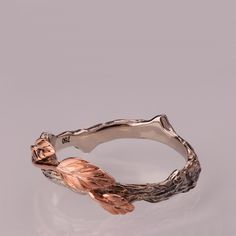 A handmade 14k twig and leaf ring made in two gold colors. Please note that the band is slightly curved since it meant to be stacked with other engagement rings for the collection. If you want it straight please mention that when you purchase. The grooves in the band are plated with black rhodium to emphasize the texture, it can also be made without it. Both the band and the leaves can be made in white, yellow or rose gold for the same price. Wedding rings are hard to choose, by now I am sure yo Elf Wedding, Bark Wedding Ring, Leaf Wedding Ring, Elven Wedding, Leaf Jewellery, Wedding Ring Rose Gold, Leaf Wedding Rings, Bush Wedding, Bird Ring