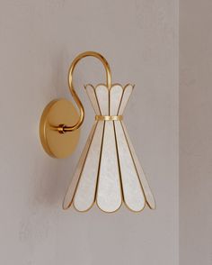 a wall light that is on the side of a wall next to a white wall